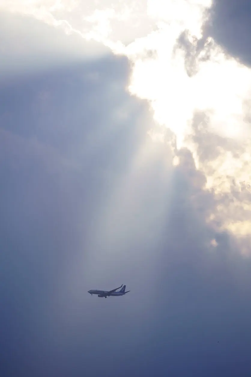 Create a mysterious landscape with rays of light